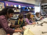 Photo of a class with children modelling with clay