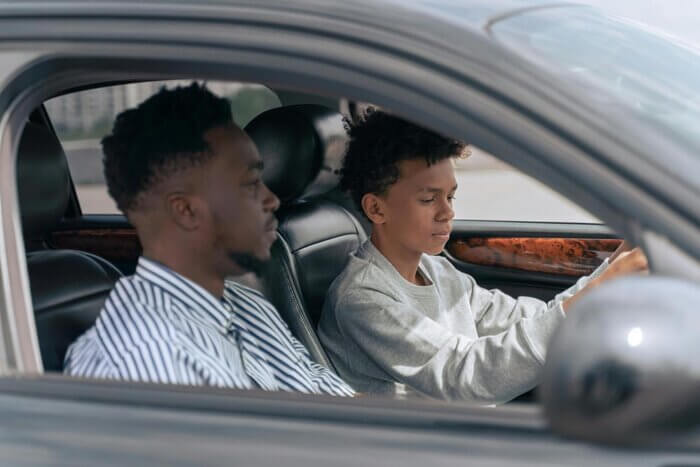A driving instructor with a learner driver